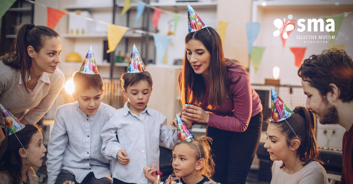 Selective Mutism and Holidays: group of children with two adults wearing party hats and celebrating